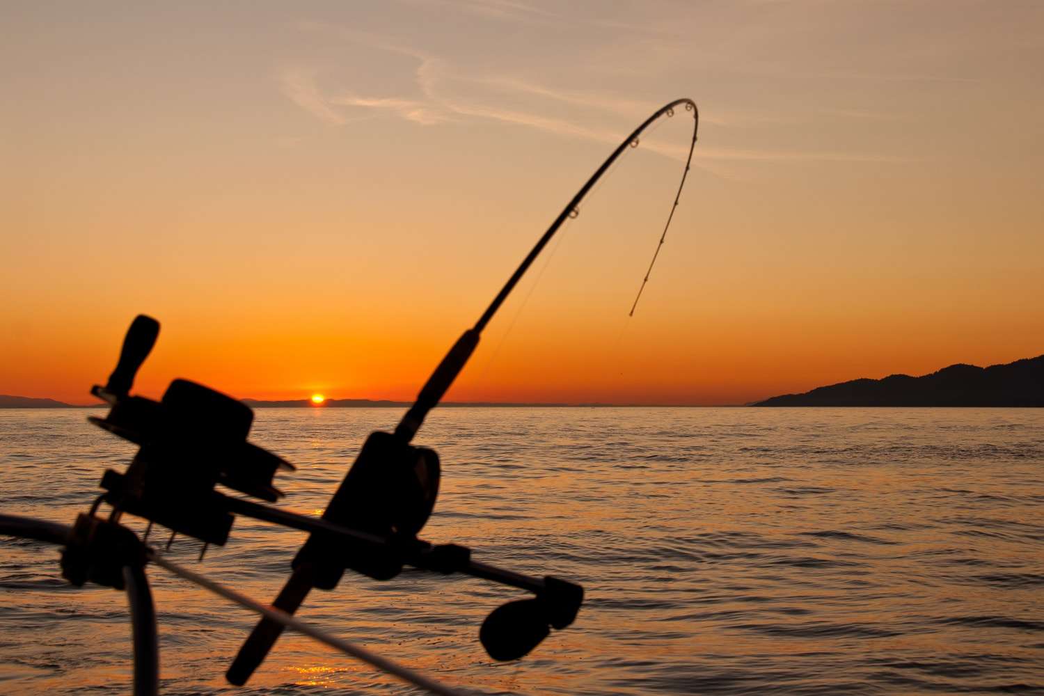 Down Rigging Fishing Rod At Sunset